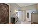 Quaint bathroom with shower, mini-fridge, custom door, and unique decor at 145 S Peninsula Dr, Daytona Beach, FL 32118