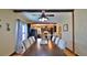 Open concept: Dining room flows into kitchen; with a ceiling fan and hardwood floors at 145 S Peninsula Dr, Daytona Beach, FL 32118