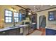 Stylish kitchen featuring modern appliances, dark cabinetry and marble countertops at 145 S Peninsula Dr, Daytona Beach, FL 32118
