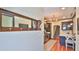 Kitchen view with wooden floors, chandelier, stainless steel appliances, and direct access to stairs at 145 S Peninsula Dr, Daytona Beach, FL 32118