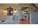 Inviting living room with arched doorway, textured walls and decorative fireplace at 145 S Peninsula Dr, Daytona Beach, FL 32118