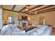 Bright living room with beams, fireplace, and unique design elements at 145 S Peninsula Dr, Daytona Beach, FL 32118
