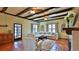 Comfortable living room with beamed ceiling, tile flooring and fireplace at 145 S Peninsula Dr, Daytona Beach, FL 32118