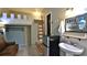 A small living space with sleeping loft has a mini-fridge, closet, and rustic decor at 145 S Peninsula Dr, Daytona Beach, FL 32118
