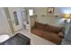 A comfortable living space includes a small sitting area, mini-fridge, sink, and closet at 145 S Peninsula Dr, Daytona Beach, FL 32118