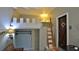 A small living space with sleeping loft features natural light, rustic decor, and modern appliances at 145 S Peninsula Dr, Daytona Beach, FL 32118