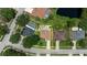 Aerial view of property highlighting private backyard pool, proximity to a pond, and nearby properties in the neighborhood at 1491 Nappa Dr, Port Orange, FL 32128