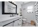 Stylish bathroom featuring modern vanity with granite counter, black hardware, and decorative accents at 1491 Nappa Dr, Port Orange, FL 32128