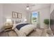 Cozy bedroom with an area rug, window views and stylish decor for a comfortable retreat at 1491 Nappa Dr, Port Orange, FL 32128