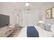 Nicely furnished bedroom featuring neutral walls, wood-look floors, and large closet at 1491 Nappa Dr, Port Orange, FL 32128