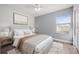 Comfortable bedroom with a large window, a plush bed, and coordinated décor in soothing tones at 1491 Nappa Dr, Port Orange, FL 32128