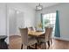 Well-lit dining space with a wooden table, comfortable chairs, and a large window at 1491 Nappa Dr, Port Orange, FL 32128