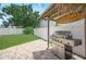 Backyard grilling area featuring a stainless steel grill and a tiki bar sign at 1491 Nappa Dr, Port Orange, FL 32128