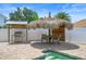 Backyard grilling area featuring a stainless steel grill, tiki bar sign, and seating at 1491 Nappa Dr, Port Orange, FL 32128