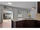 Close up shot of the kitchen area with granite counter tops and an outdoor view at 1491 Nappa Dr, Port Orange, FL 32128