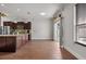 Kitchen featuring wood floors, stainless appliances, granite countertops and kitchen island at 1491 Nappa Dr, Port Orange, FL 32128