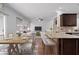 Open concept living room and kitchen with breakfast bar and dining area at 1491 Nappa Dr, Port Orange, FL 32128