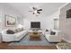 Living room with plenty of natural light, ceiling fan and access to an open concept kitchen at 1491 Nappa Dr, Port Orange, FL 32128