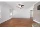 Open concept living room with wood floors and neutral walls at 1491 Nappa Dr, Port Orange, FL 32128