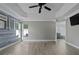 Spacious main bedroom with an ensuite bathroom and light wood-look floors at 1491 Nappa Dr, Port Orange, FL 32128