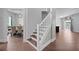 Classic staircase showcasing wood treads and white risers, connecting multiple levels of the home at 1491 Nappa Dr, Port Orange, FL 32128