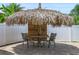 Tiki hut featuring bar-style seating, wooden structure, and tropical accents at 1491 Nappa Dr, Port Orange, FL 32128