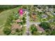 Expansive aerial view of the neighborhood with lush greenery and well-maintained homes at 160 Point O Woods Dr, Daytona Beach, FL 32114