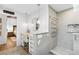 Charming bathroom with a makeup vanity, round mirror, towel warmer and step in shower with glass door at 160 Point O Woods Dr, Daytona Beach, FL 32114