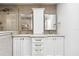 Modern bathroom with double vanity, cabinets and drawers, and a tiled shower at 160 Point O Woods Dr, Daytona Beach, FL 32114