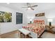 Charming bedroom featuring a colorful bed, stylish decor, and a cozy atmosphere at 160 Point O Woods Dr, Daytona Beach, FL 32114