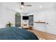 Bright bedroom with a comfortable chair, modern decor, and plenty of natural light at 160 Point O Woods Dr, Daytona Beach, FL 32114