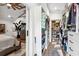 Walk-in closet featuring custom shelving and drawers, rods, and bedroom with ceiling fan nearby at 160 Point O Woods Dr, Daytona Beach, FL 32114