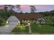Beautiful home featuring manicured landscaping, inviting curb appeal, and elegant exterior finishes at 160 Point O Woods Dr, Daytona Beach, FL 32114