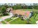 Beautiful home with a lush green lawn, manicured landscaping, and a paver driveway and walkway at 160 Point O Woods Dr, Daytona Beach, FL 32114