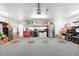 Tidy garage features a durable epoxy floor, overhead storage, and ample space for vehicles and projects at 160 Point O Woods Dr, Daytona Beach, FL 32114