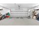 Spacious two-car garage with epoxy flooring and white walls, perfect for storage and organization at 160 Point O Woods Dr, Daytona Beach, FL 32114