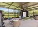 Enclosed golf simulator area providing entertainment and practice with comfortable seating, ideal for year-round enjoyment at 160 Point O Woods Dr, Daytona Beach, FL 32114