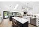 Modern kitchen featuring double islands, stainless steel appliances, and an open floor plan at 160 Point O Woods Dr, Daytona Beach, FL 32114