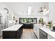 Open kitchen with an island, stainless steel appliances, and an open floor plan with a view outside at 160 Point O Woods Dr, Daytona Beach, FL 32114