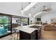 Bright kitchen featuring a large island, skylight, and an open layout at 160 Point O Woods Dr, Daytona Beach, FL 32114