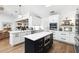 Spacious kitchen with an open floor plan, a center island, stainless steel appliances, and wood floors at 160 Point O Woods Dr, Daytona Beach, FL 32114