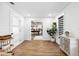 Spacious living room boasts wood floors, white walls, and an opening to the game room at 160 Point O Woods Dr, Daytona Beach, FL 32114