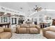 Open-concept living space showcases a pool table, eat-in kitchen, and comfortable seating area at 160 Point O Woods Dr, Daytona Beach, FL 32114