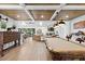 Spacious living area features wood ceiling, pool table, and flows into the kitchen with a breakfast bar at 160 Point O Woods Dr, Daytona Beach, FL 32114