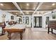 Wood ceiling living room features a pool table and front door entry at 160 Point O Woods Dr, Daytona Beach, FL 32114
