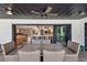 Charming outdoor patio with comfortable seating, perfect for dining and entertaining with views to the kitchen at 160 Point O Woods Dr, Daytona Beach, FL 32114