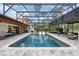 Beautiful backyard pool with a hot tub and outdoor seating, offering an excellent space for recreation and relaxation at 160 Point O Woods Dr, Daytona Beach, FL 32114