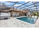 Backyard pool with hot tub and outdoor barbecue, creating an ideal space for relaxation and social gatherings at 160 Point O Woods Dr, Daytona Beach, FL 32114