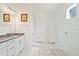 Bathroom features modern vanity, frameless mirror and glass-enclosed shower with white subway tile surround at 16241 Honey Harvest St, Winter Garden, FL 34787