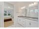 Bathroom showcases dual vanity, frameless mirror, glass-enclosed shower with white subway tile, and opens to bedroom at 16241 Honey Harvest St, Winter Garden, FL 34787